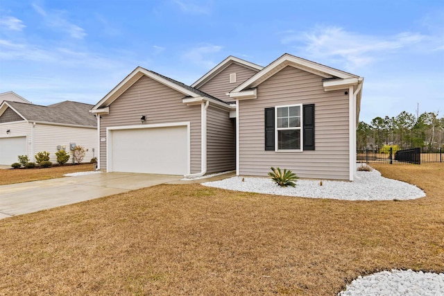 view of front of home featuring a garage and a front lawn