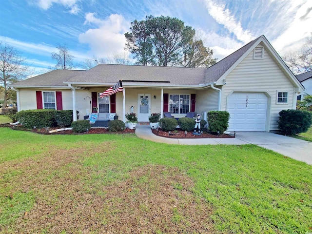 ranch-style house featuring a front lawn, covered porch, and a garage