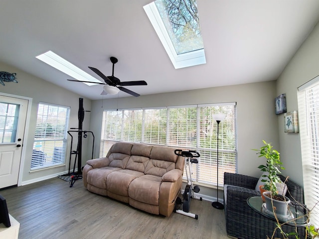 living room with ceiling fan, vaulted ceiling, and hardwood / wood-style flooring