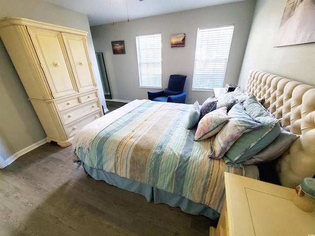 bedroom featuring dark hardwood / wood-style flooring