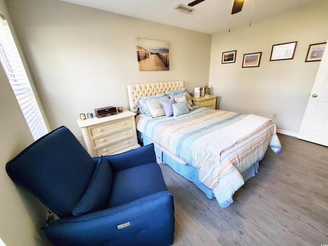 bedroom featuring ceiling fan and hardwood / wood-style floors