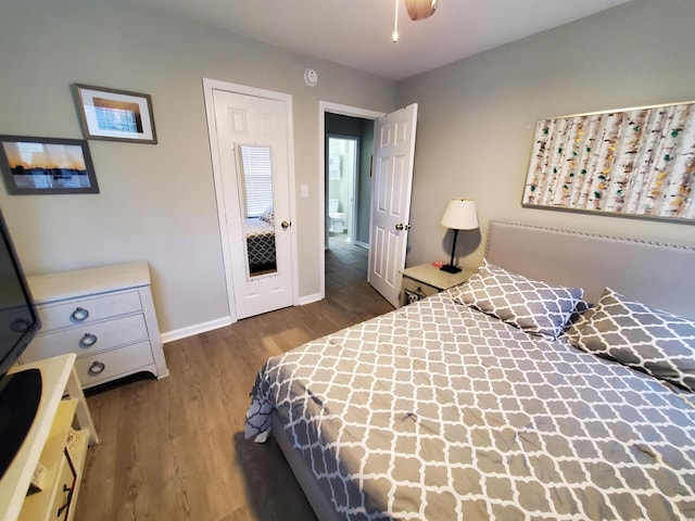 bedroom featuring dark wood-type flooring and ceiling fan