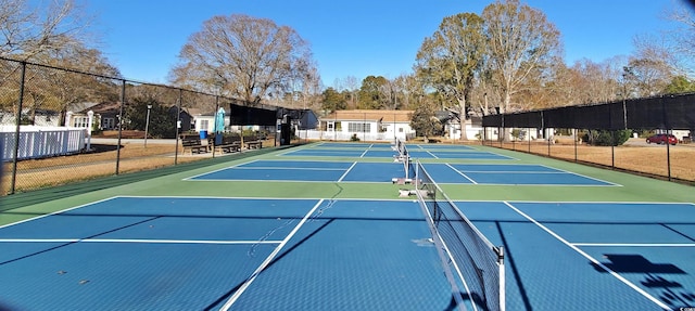 view of tennis court featuring basketball court