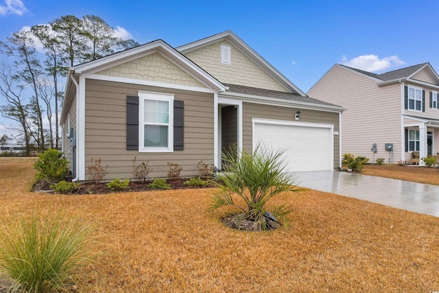 craftsman-style home featuring a garage and a front lawn