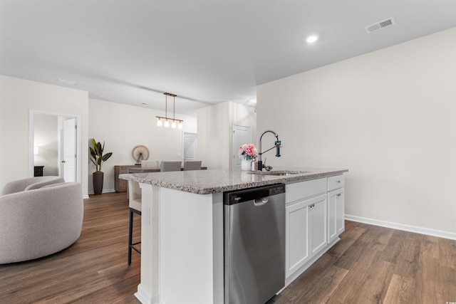 kitchen featuring dishwasher, sink, an island with sink, decorative light fixtures, and white cabinetry