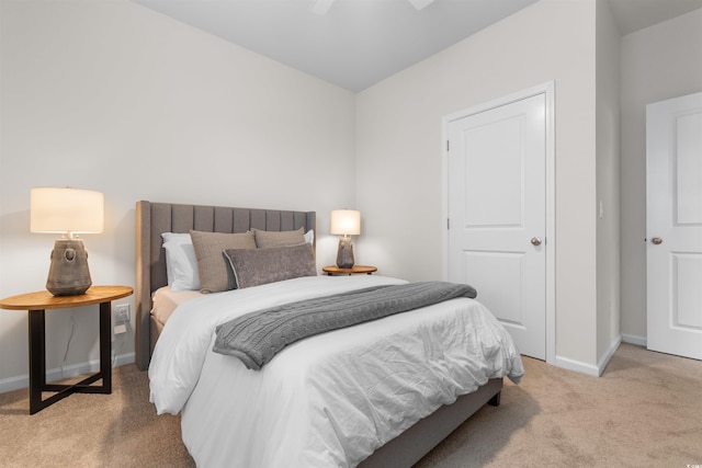 carpeted bedroom featuring ceiling fan