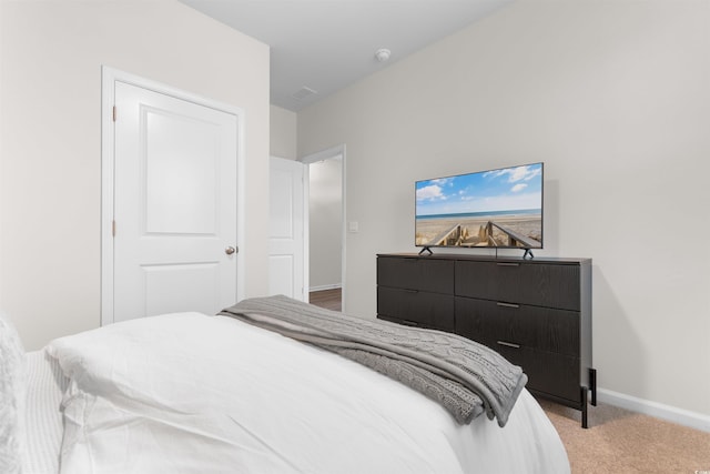 carpeted bedroom with a closet