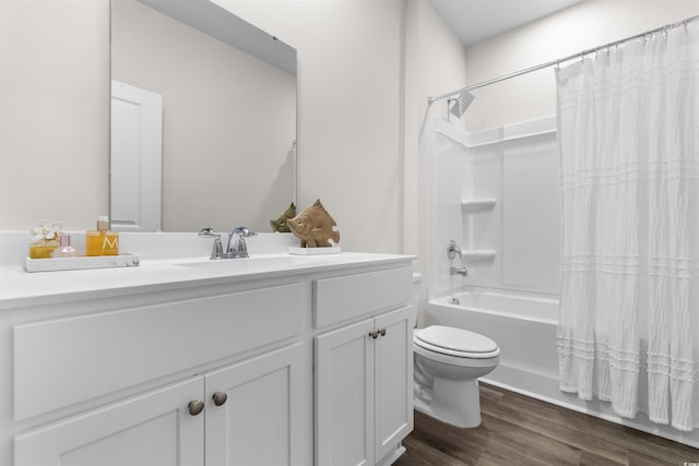 full bathroom with shower / bath combo with shower curtain, vanity, hardwood / wood-style floors, and toilet