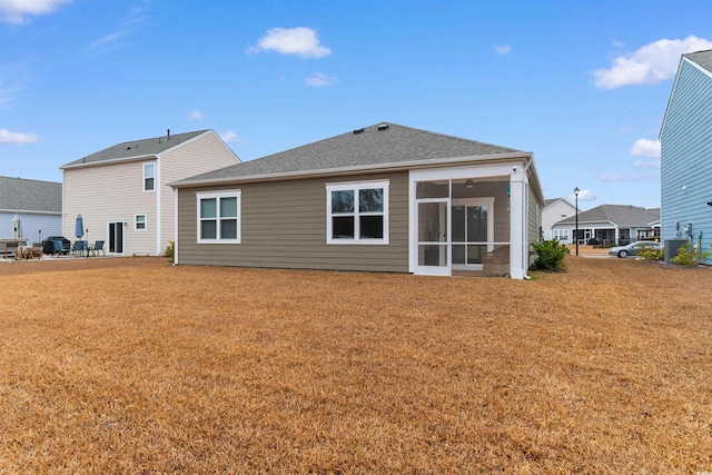 back of property featuring a sunroom