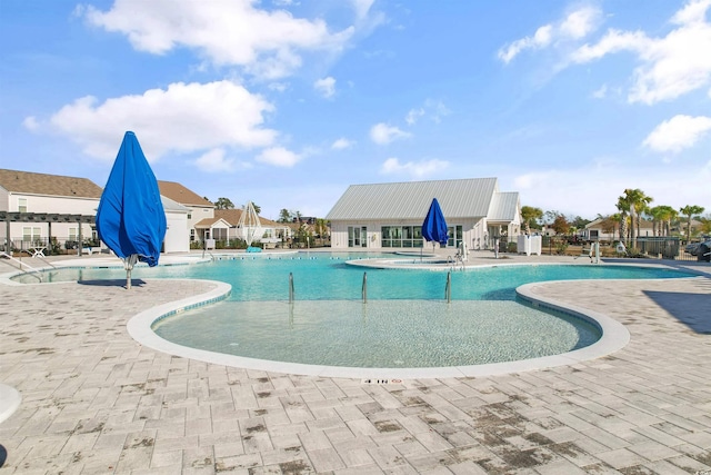 view of swimming pool with a patio area