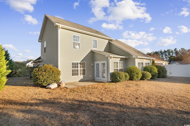 rear view of property featuring french doors and a patio