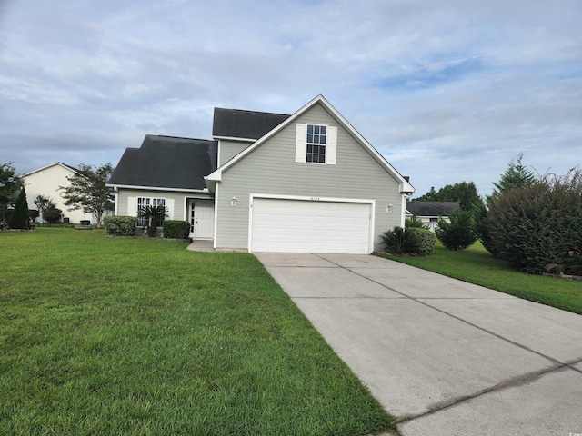 front of property featuring a front lawn and a garage