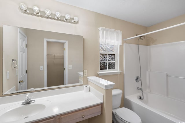 full bathroom featuring toilet, shower / bathing tub combination, and vanity