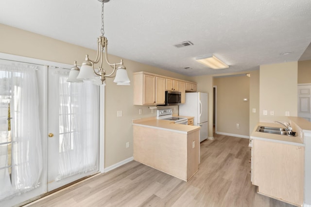 kitchen featuring white appliances, kitchen peninsula, decorative light fixtures, light hardwood / wood-style floors, and sink