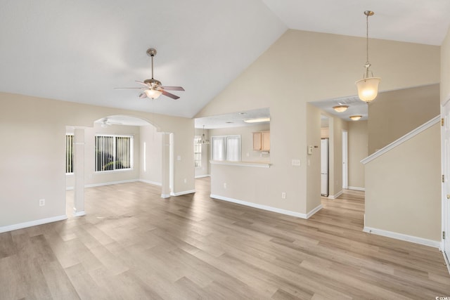 unfurnished living room featuring ceiling fan, light wood-type flooring, and high vaulted ceiling