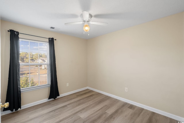 unfurnished room featuring ceiling fan and light hardwood / wood-style flooring