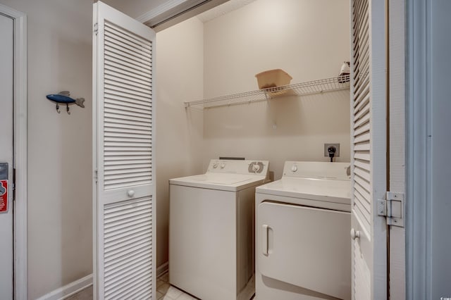 clothes washing area featuring washer and clothes dryer