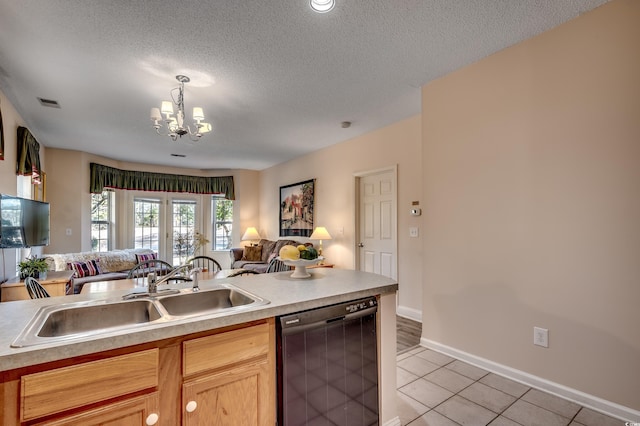 kitchen featuring light tile patterned floors, black dishwasher, a textured ceiling, and sink