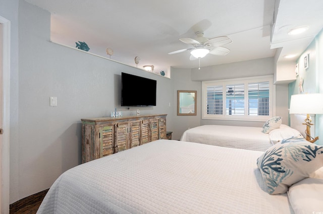 4800 S Ocean Blvd Unit 1007, North Myrtle Beach, SC 29582 - bedroom with ceiling fan and dark wood-type flooring