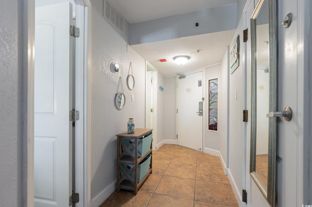 4800 S Ocean Blvd Unit 1007, North Myrtle Beach, SC 29582 - corridor with baseboards and light tile patterned flooring