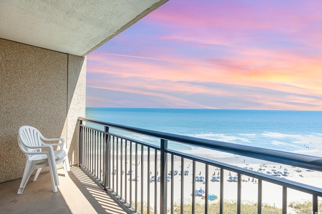 4800 S Ocean Blvd Unit 1007, North Myrtle Beach, SC 29582 - balcony at dusk with view of water and beach