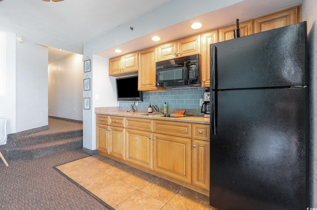 4800 S Ocean Blvd Unit 1007, North Myrtle Beach, SC 29582 - kitchen with black appliances, light colored carpet, decorative backsplash, recessed lighting, and light tile patterned floors