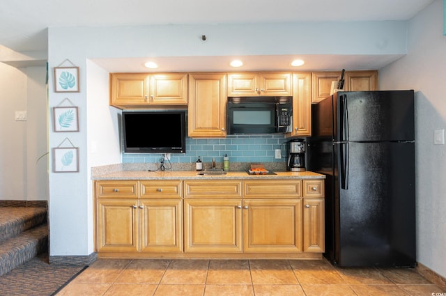 4800 S Ocean Blvd Unit 1007, North Myrtle Beach, SC 29582 - kitchen featuring black appliances, decorative backsplash, light stone countertops, recessed lighting, and light tile patterned floors