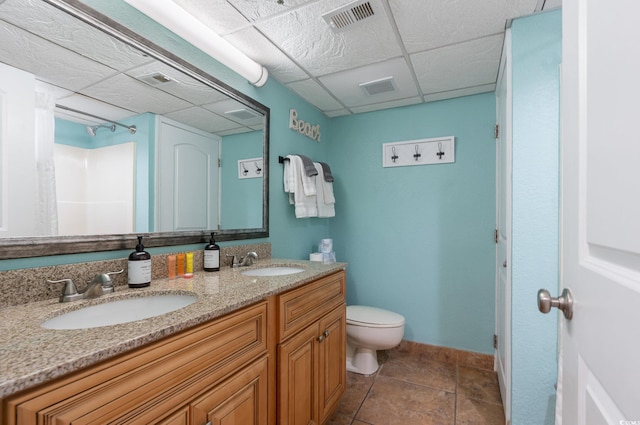 4800 S Ocean Blvd Unit 1007, North Myrtle Beach, SC 29582 - full bathroom with double vanity, a drop ceiling, and tile patterned flooring