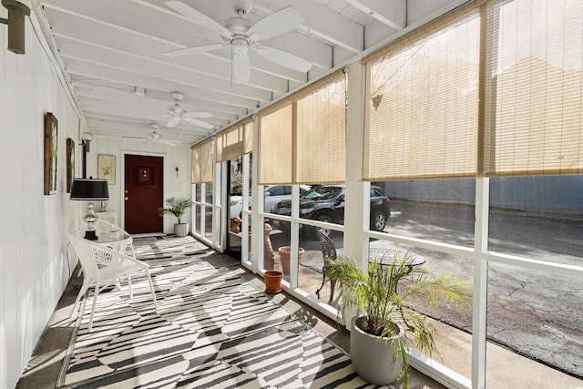 sunroom / solarium featuring ceiling fan