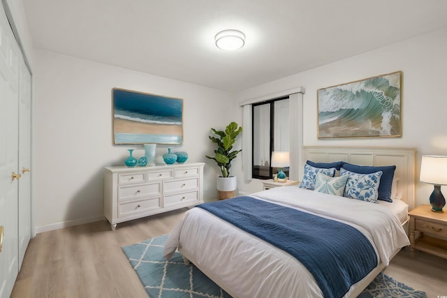 bedroom with light hardwood / wood-style flooring