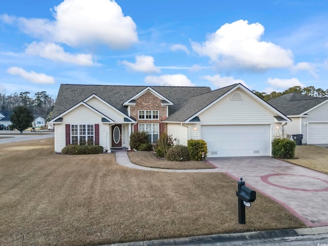 view of front of house with a garage and a front lawn