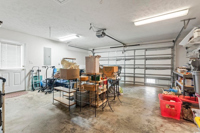 garage featuring a garage door opener and electric panel