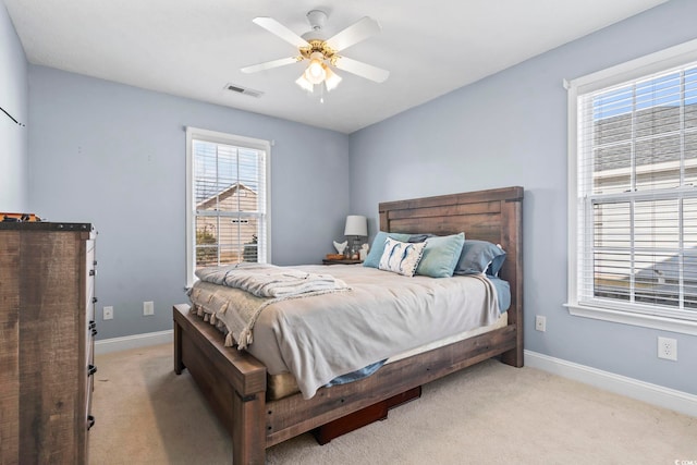 bedroom featuring ceiling fan and light colored carpet