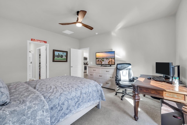 bedroom featuring ceiling fan and light carpet