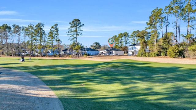 surrounding community featuring a lawn