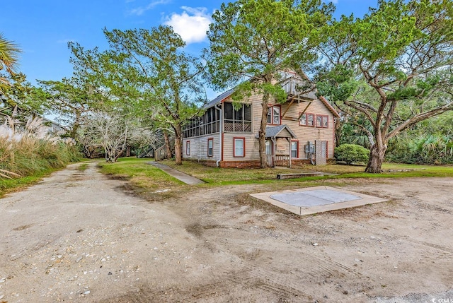 view of front of house with a sunroom