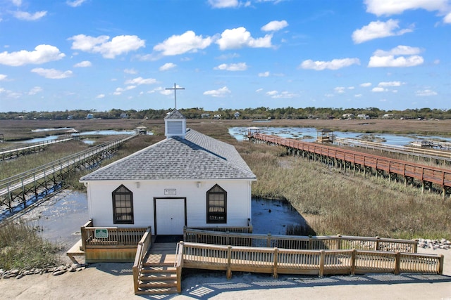 exterior space with a water view