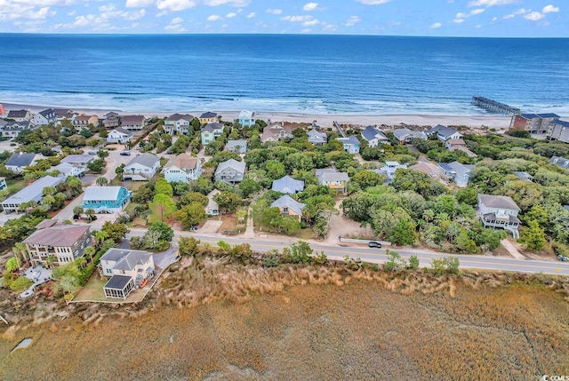 birds eye view of property featuring a water view and a view of the beach