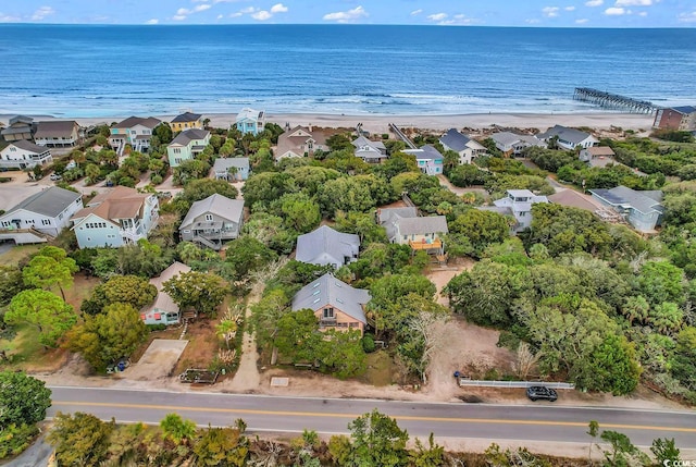 bird's eye view with a beach view and a water view