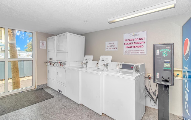 laundry room featuring stacked washer and dryer, a textured ceiling, and independent washer and dryer