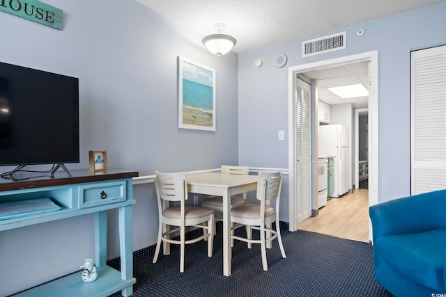 view of carpeted dining space