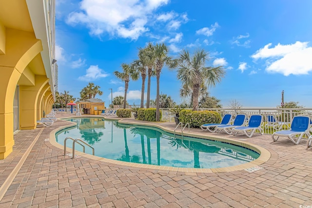 view of pool featuring a patio area