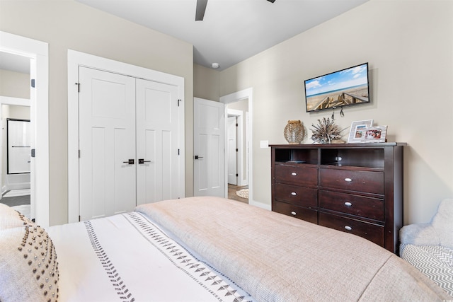 bedroom with a closet, ceiling fan, and ensuite bathroom