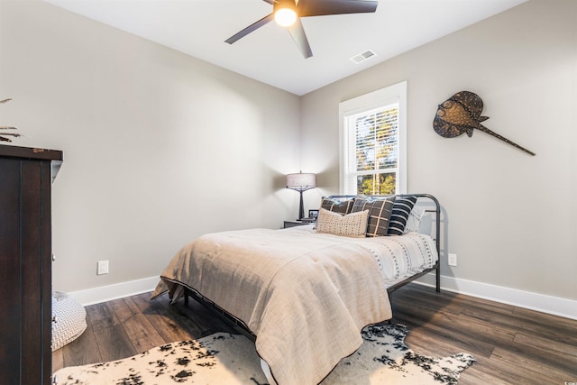 bedroom featuring dark hardwood / wood-style floors and ceiling fan