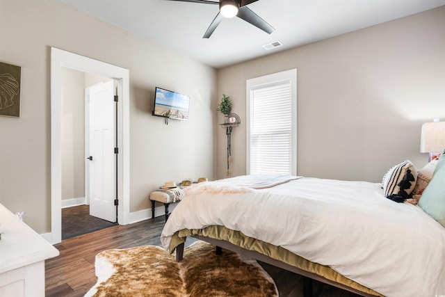 bedroom with dark wood-type flooring and ceiling fan