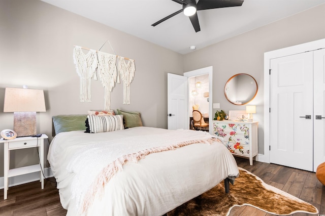 bedroom with dark hardwood / wood-style flooring and ceiling fan