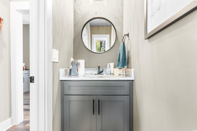 bathroom with vanity and hardwood / wood-style floors