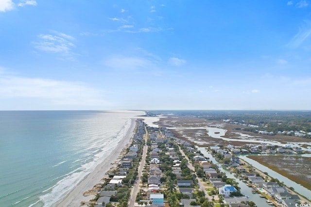 birds eye view of property with a view of the beach and a water view