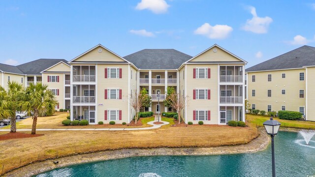 2080 Cross Gate Blvd Unit 303, Surfside Beach, SC 29575 - view of swimming pool featuring a yard and a sunroom
