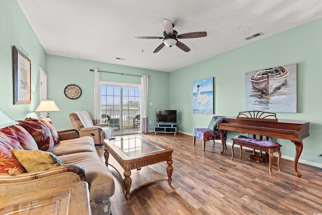 2080 Cross Gate Blvd Unit 303, Surfside Beach, SC 29575 - living area featuring a ceiling fan, wood finished floors, and baseboards